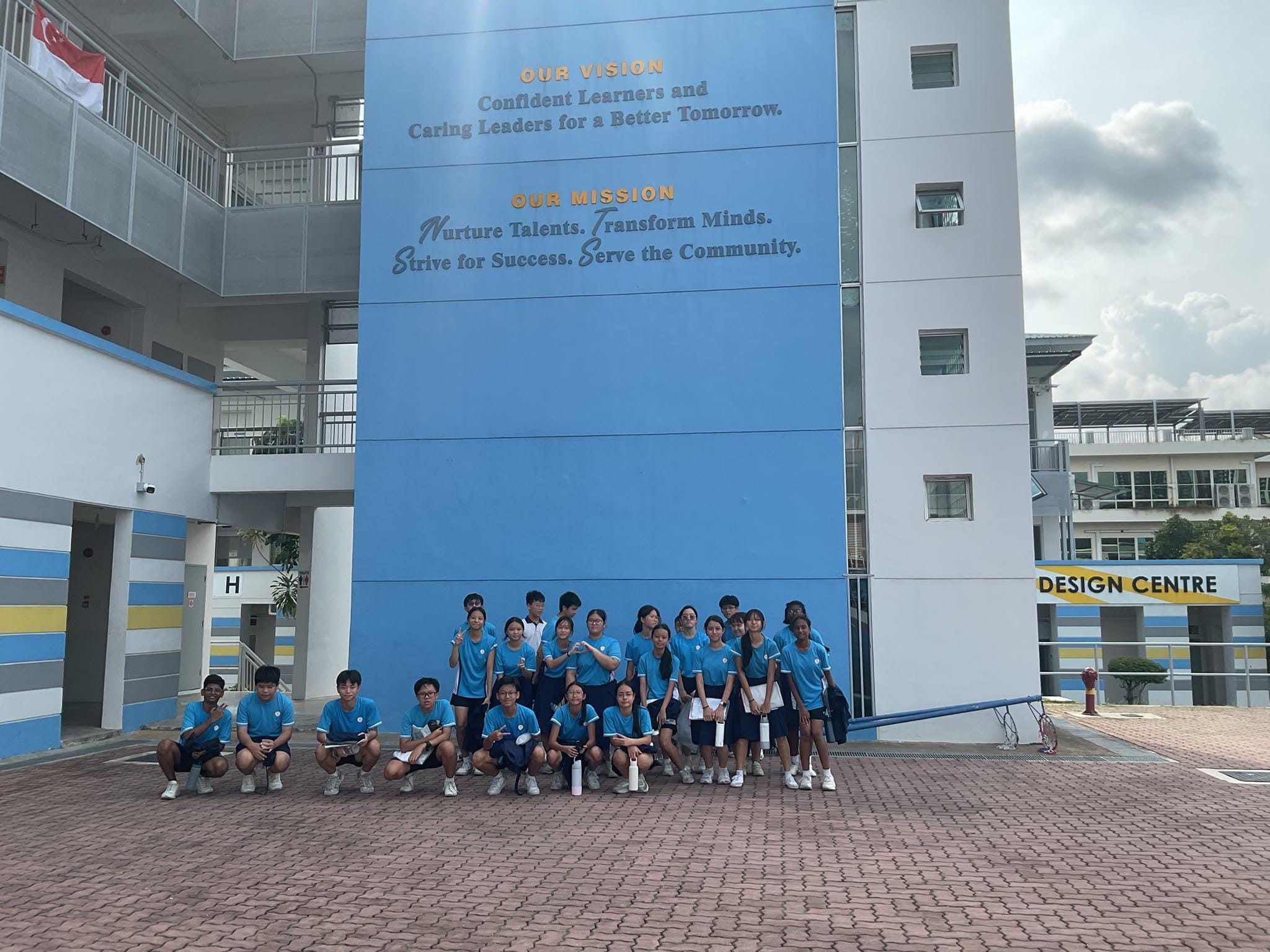 Students posing at the parade grounds after completing the scavenger hunt missions